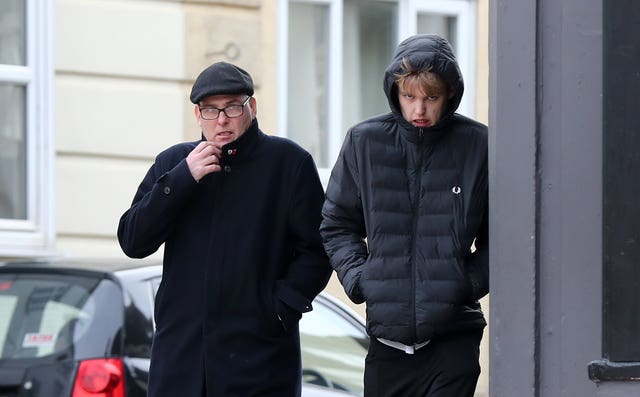 Burnley fans Stewart Higgins, left, and his son Nathan Higgins arrive at Brighton Magistrates' Court 