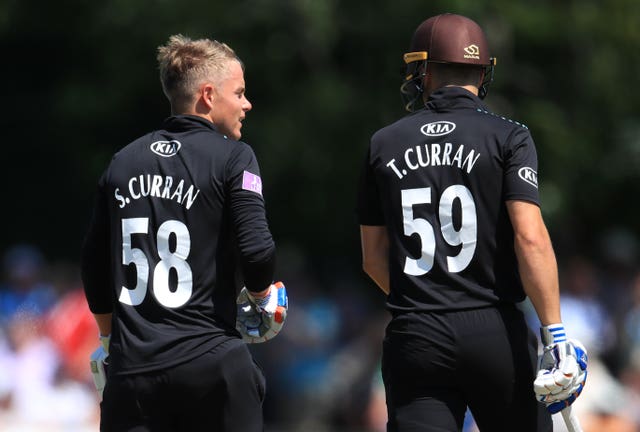Surrey’s Sam Curran, left, and his brother Tom Curran talk while batting together against Worcestershire