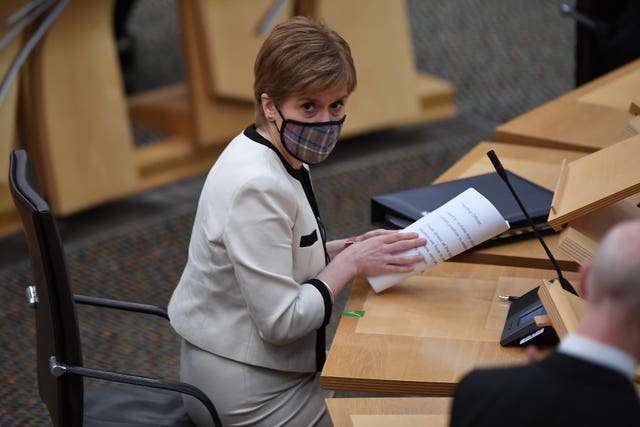 First Minister Nicola Sturgeon, wearing a face mask, ahead of a statement on new COVID-19 restrictions at the Scottish Parliament in Holyrood, Edinburgh. Among the stricter rules announced by the First Minister are a ban on drinking alcohol outdoors in public areas under lockdown and further restrictions on takeaways and click and collect services