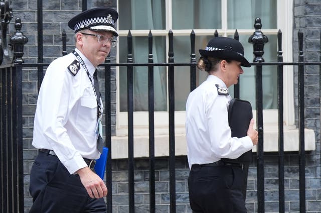 Metropolitan Police Assistant Commissioner Matt Twist (left) and Deputy Commissioner Lynne Owens leave Downing Street after the meeting