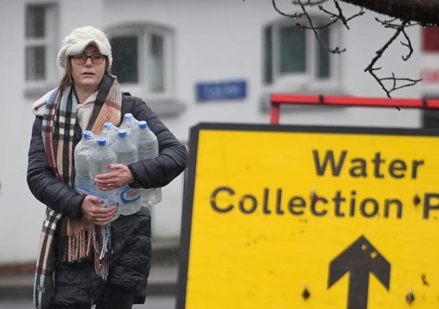 People collect bottled water