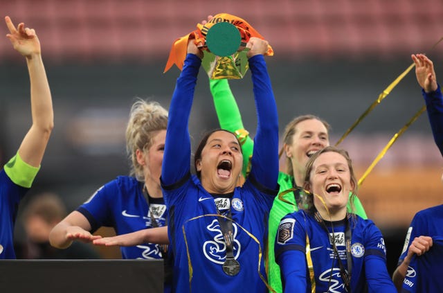 Sam Kerr (centre) celebrates with the trophy after her hat-trick helped Chelsea beat Bristol City 6-0 in the Continental League Cup final at Vicarage Road (Mike Egerton/PA).