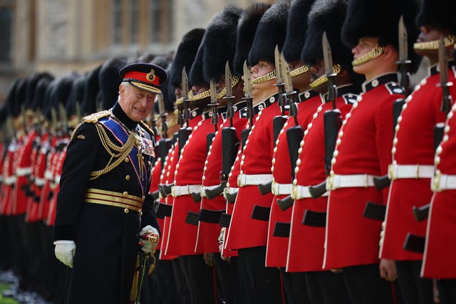 The King inspects the troops at Horse Guards Parade for his official birthday celebrations
