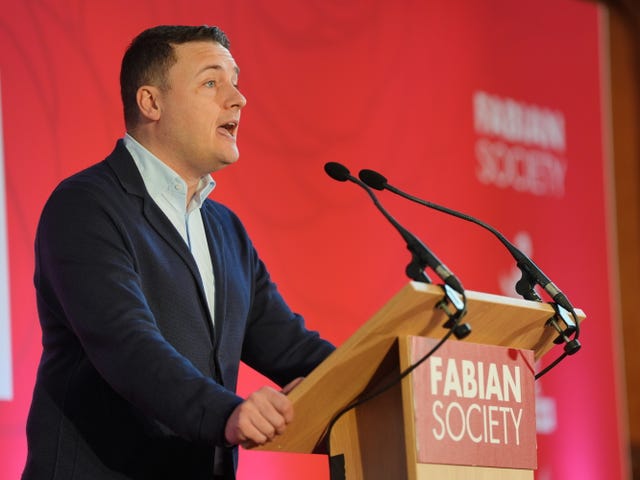 Health Secretary Wes Streeting stands at a lectern