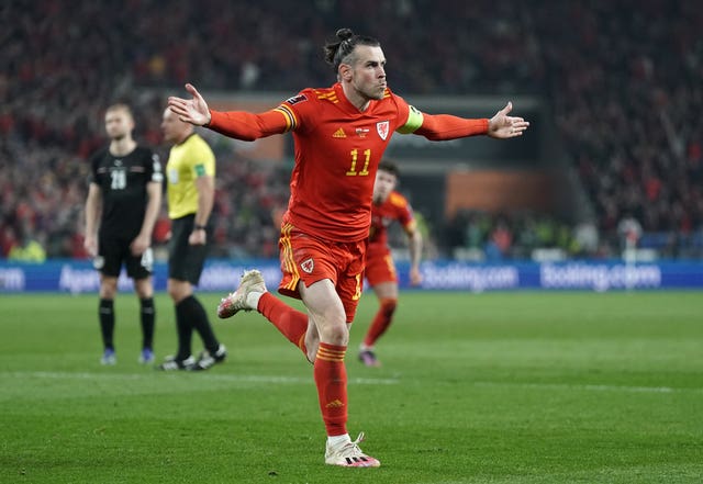 Gareth Bale celebrates scoring Wales' second goal against Austria in World Cup qualifying