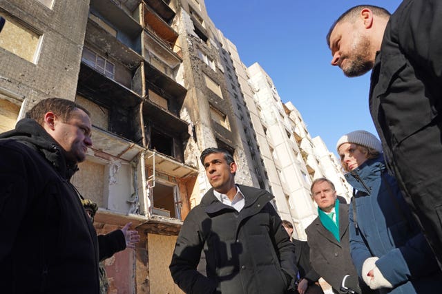 The Prime Minister being shown damaged buildings in Kyiv during his visit 