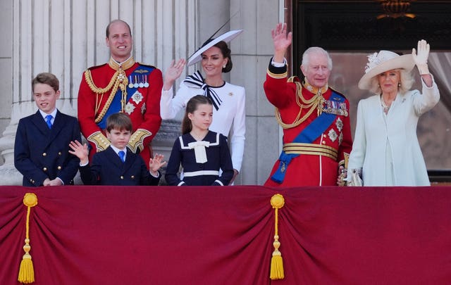 The Prince and Princess of Wales with their children, Prince George, Prince Louis, and Princess Charlotte, stand with the King and Queen on the Palace balcony after Trooping the Colour in June