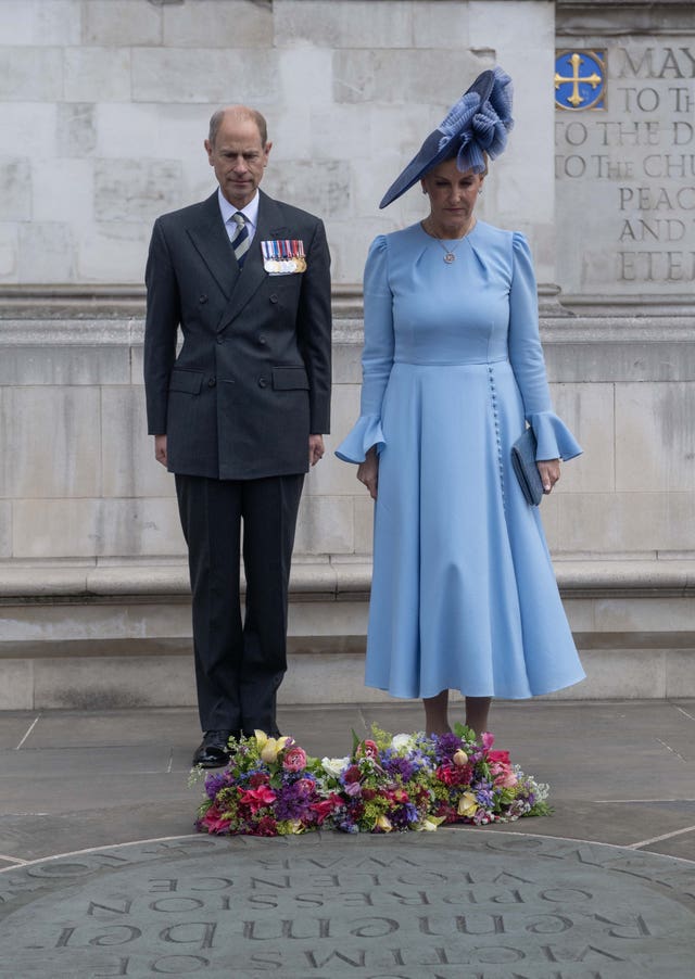 The Duke and Duchess of Edinburgh standing beside a wreath