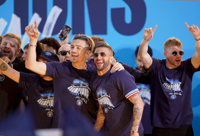 Kevin De Bruyne, right, during the Premier League trophy parade in Manchester on Monday 