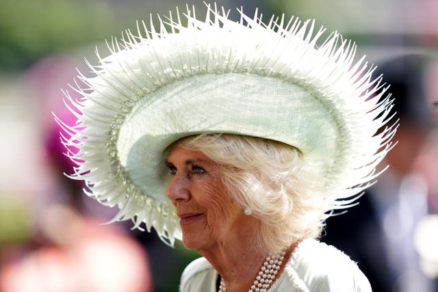 The Queen wearing a hat at Ascot racecourse