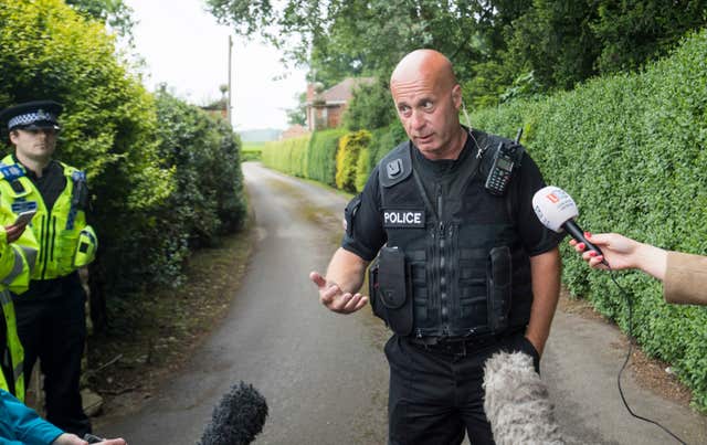 Superintendent David Hannan talks to the press near the scene of the helicopter crash (Danny Lawson/PA)