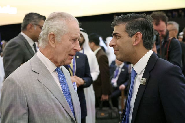 King Charles III speaks with Prime Minister Rishi Sunak as they attend the opening ceremony of the World Climate Action Summit at Cop28 in Dubai (Chris Jackson/PA)