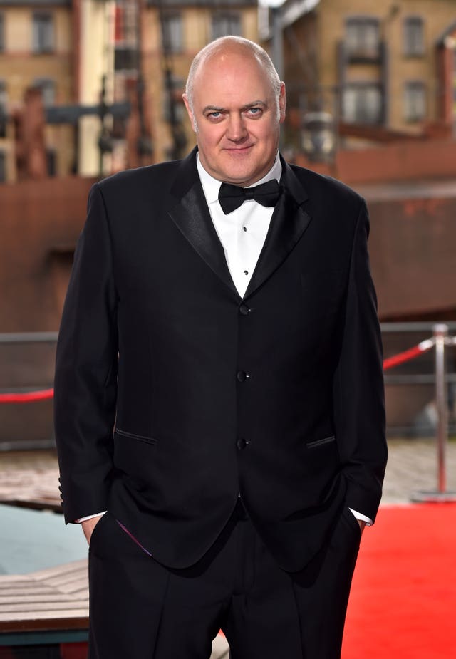 Dara O Briain in a suit on a red carpet