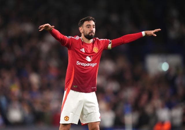 Manchester United’s Bruno Fernandes holds his arms out during the Premier League match at Stamford Bridge