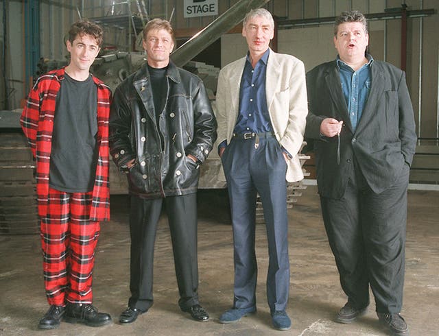 Villains of the new James Bond film Goldeneye line up in front of a tank during a photocall at Leavesden Airfield, Herts, on January 22 1995. L/R, Alan Cumming who is Boris, Sean Bean who plays rouge agent 006, Alec Trevelyan, Gottfried John who is Ourumov and Robbie Coltrane who plays Valentin. Christmas 1995 is the projected world-wide release date for the 40 million thriller