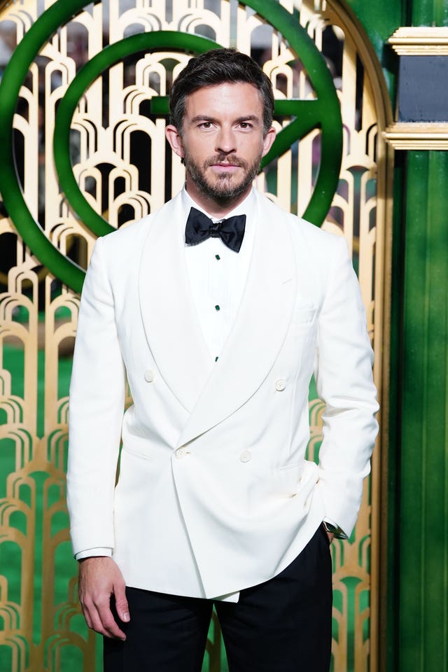 Jonathan Bailey in a white dinner jacket