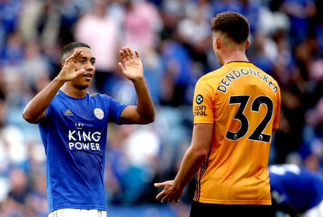 Youri Tielemans, left, greets Leander Dendoncker at the end of the match