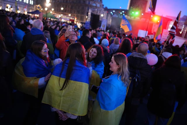 People gather in Trafalgar Square, central London, to mark the third anniversary of Russia’s invasion