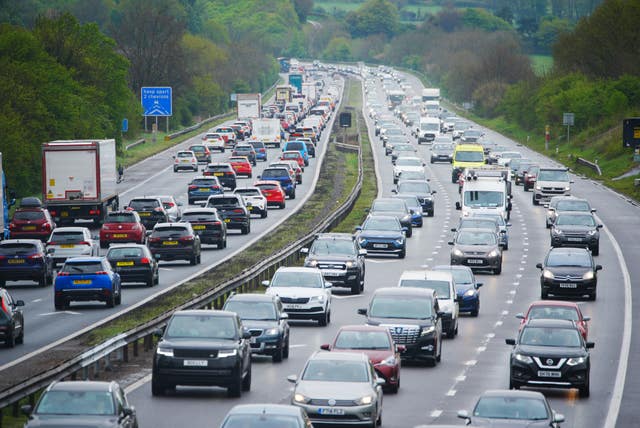Cars queue in motorway lanes