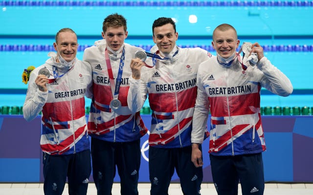 Team GB's 4x100m medley relay team holding medals