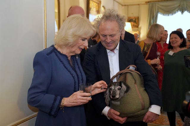 The Queen Consort meets author Charlie Mackesy and his dog Barney