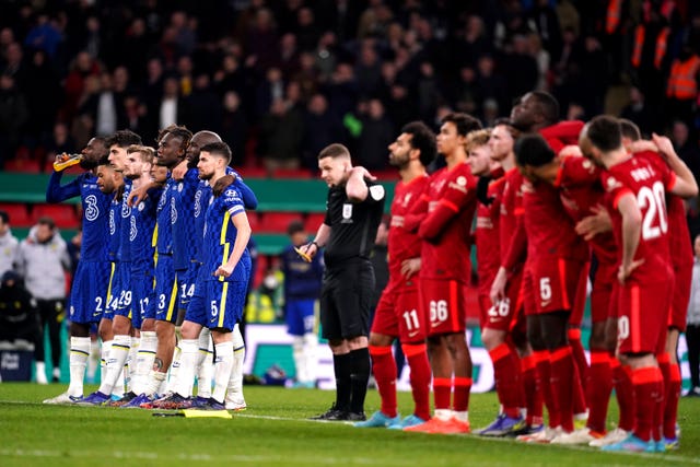 Chelsea (left) and Liverpool players prepare to take penalties