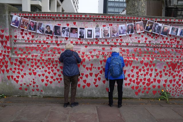 The National Covid Memorial Wall remembers those who died in the pandemic (Stefan Rousseau/PA)