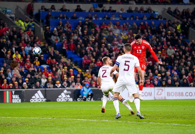 Kieffer Moore, right, scores Wales' winner against Latvia