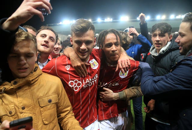 Bristol City’s Jamie Paterson (left) and Bobby Reid celebrate after the win against Manchester United 