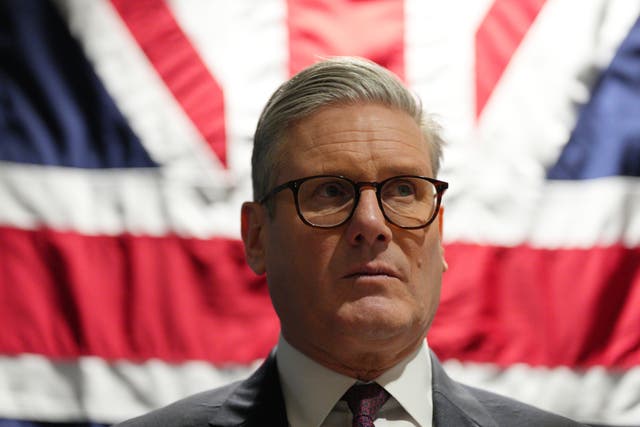 Sir Keir Starmer in front of a British flag