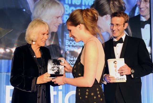 Camilla presents Eleanor Catton, centre, with the Man Booker Prize for her book The Luminaries 