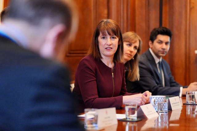 Rachel Reeves around a table meeting with regulators