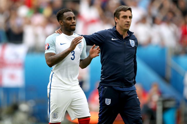 Former England coach Gary Neville (right) celebrates Euro 2016 finals victory over Wales with Danny Rose