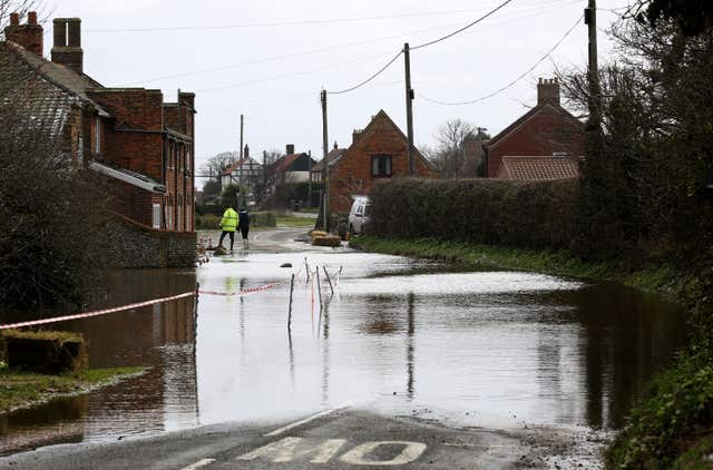 More homes and properties will be at risk of coastal flooding as a result of climate change, the experts warn (Chris Radburn/PA)