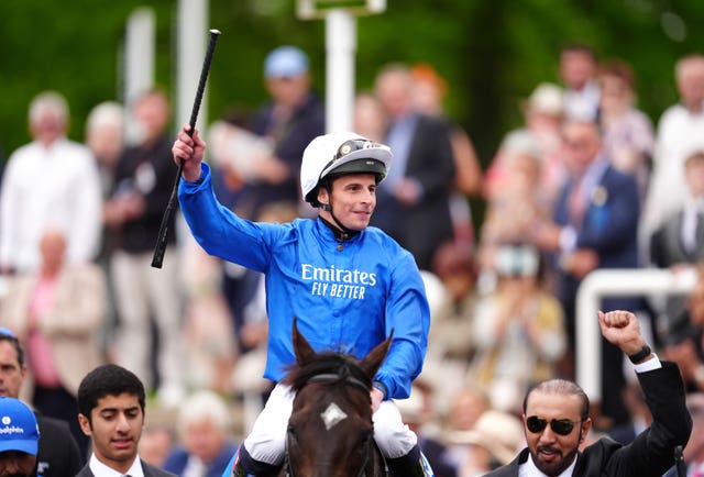 William Buick celebrates winning the 2000 Guineas on Ruling Court 