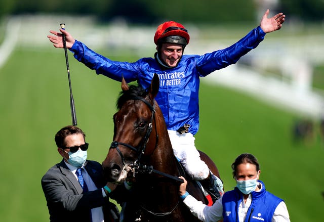 Adam Kirby celebrates on top of Adayar after winning the Cazoo Derby during day two of the Cazoo Derby Festival at Epsom Racecourse