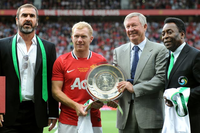 Pele, right, joins Manchester United manager Sir Alex Ferguson, second right, and former Manchester United forward Eric Cantona, left, at Paul Scholes' testimonial in August 2011. United midfielder Scholes, second left, was honoured for his service to the club with a match against New York Cosmos at Old Trafford