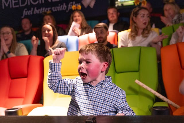 Oliver Christie, aged five, watches the Randox Grand National in the MediCinema at Alder Hey Children's Hospital in Liverpool with his friends and family