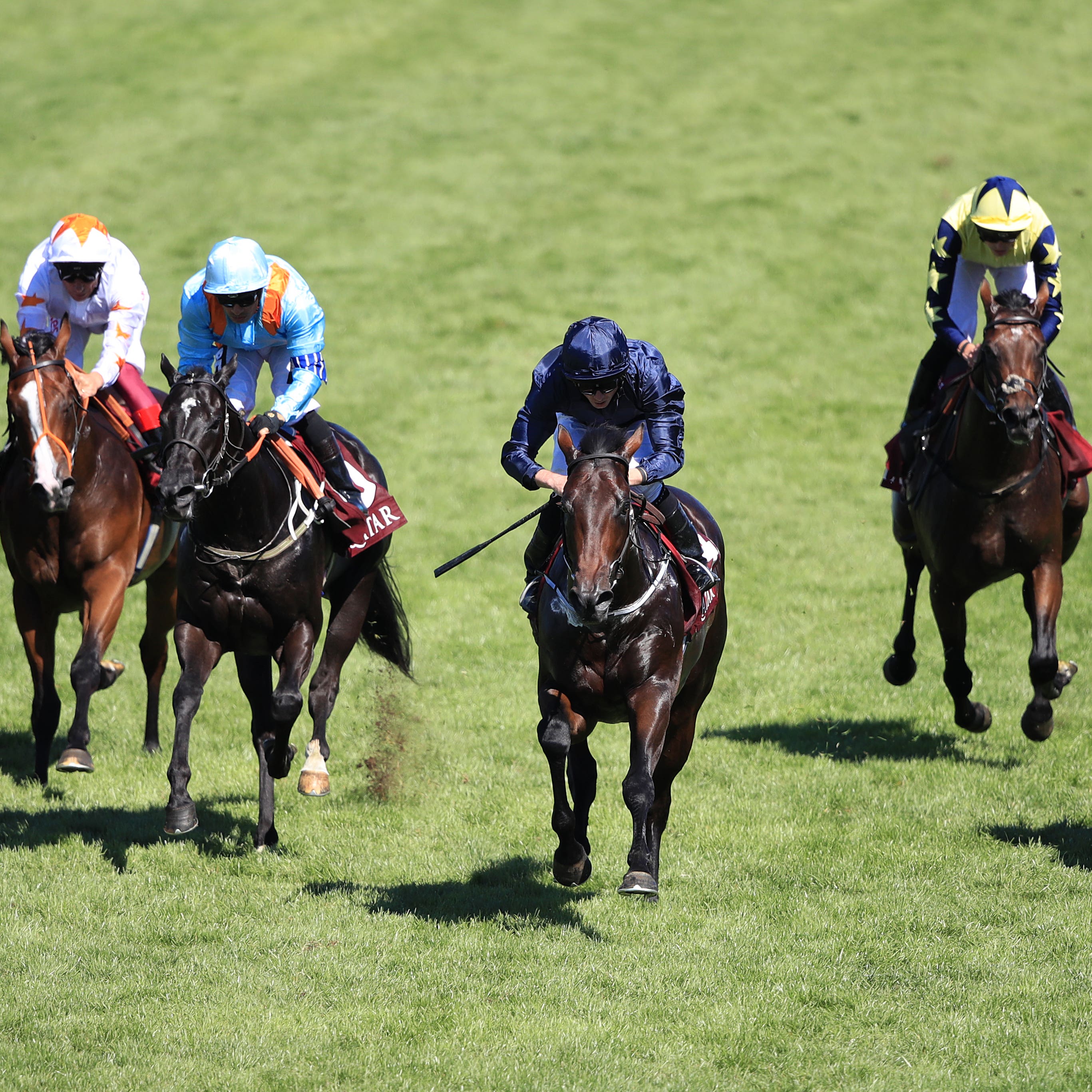 Land Force (centre) comes home to win the Vintage Stakes at Goodwood