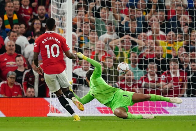 Marcus Rashford scores past Alisson Becker