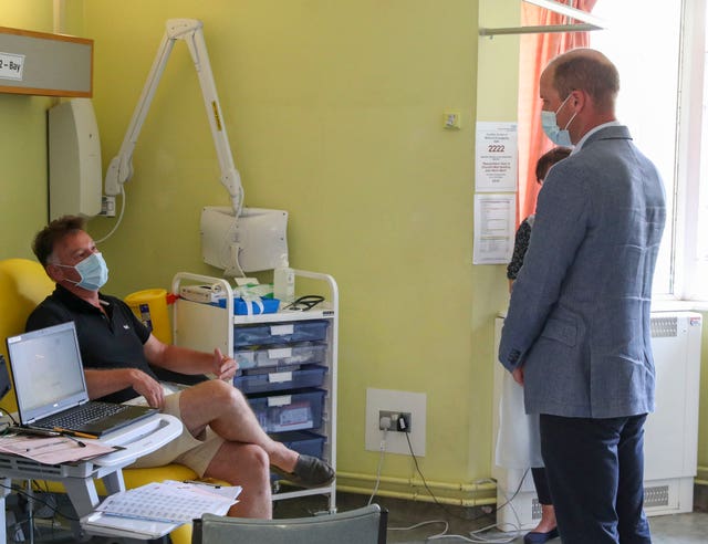 The Duke of Cambridge talks to a patient participating in the Covid-19 vaccine trial last year