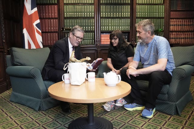 Figen Murray, mother of Manchester Arena bombing victim Martyn Hett, and her husband Stuart speaking to Sir Keir Starmer at the Houses of Parliament in May 2024