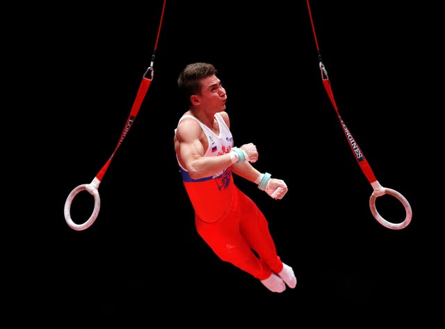 Russian gymnast David Belyavskiy competes on the Still Rings at the 2015 World Gymnastic Championships in Glasgow