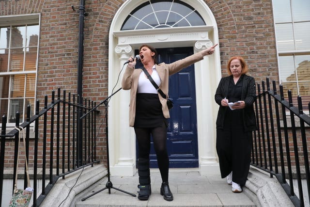 Natasha O’Brien and Ruth Coppinger join protesters outside Leinster House in Dublin