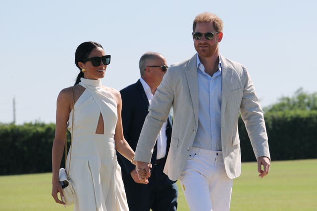 The Duke and Duchess of Sussex holding hands