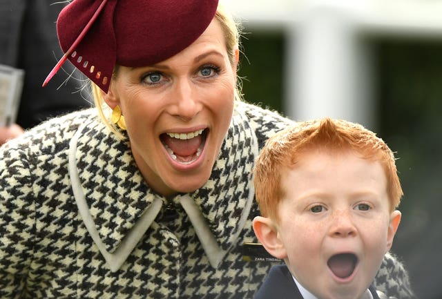 Zara Tindall poses alongside Archie McCoy, the son of jockey AP McCoy, during the RSA Insurance Novices' Chase on Ladies Day at Cheltenham Festival. It was day to remember for six-year-old Archie as he watched the horse named after his father – Champ – ridden to victory by jockey Barry Geraghty
