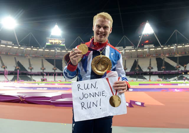 Jonnie Peacock celebrates with his gold medal