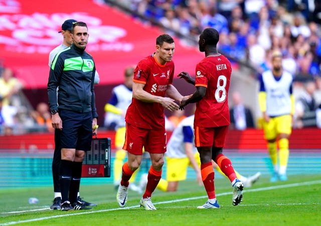 Liverpool’s Naby Keita is substituted for team-mate James Milner