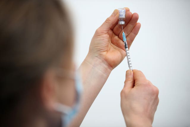 A vaccine dose being prepared