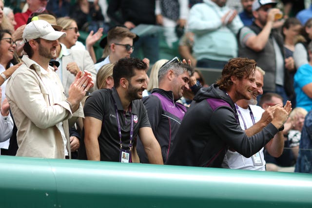 Morgan Phillips, back centre with sunglasses on his head, helped Henry Searle to Wimbledon glory 